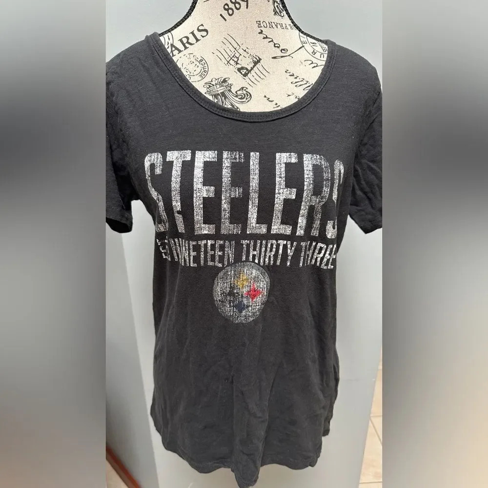 Steeler women’s T-shirt. Size large with slit sleeves